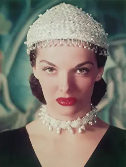 Prints of Headshot of actress Jane Russell pictured wearing a pearl-studded skull cap, with a fringe of pearls, USA, circa 1955. Russell is also wearing a pearl choker. (Photo by Archive Photos/Getty Images) Hollywood's Sultry Siren – A Photographic Tribute: Jane Russell