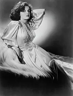 Prints of Actress Jane Russell with her left arm held behind her head, USA, circa 1950; she is wearing a long silk gown. (Photo by Archive Photos/Getty Images) Hollywood's Sultry Siren – A Photographic Tribute: Jane Russell
