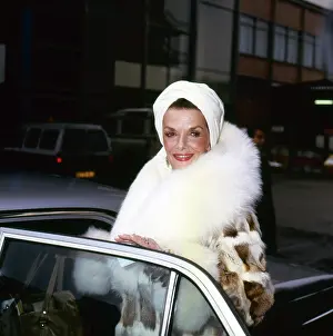 Prints of Photo of American actress Jane Russell (1921 - 2011) as she stands in the open door of a car outside an airport, London, England, March 1, 1986. (Photo by TPLP/Getty Images) Hollywood's Sultry Siren – A Photographic Tribute: Jane Russell At An Airport