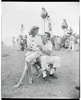 Prints of (Original Caption). Our boy and girl - Richard Egan and Jane Russell - run their lines Hollywood's Sultry Siren – A Photographic Tribute: Jane Russell and Richard Egan