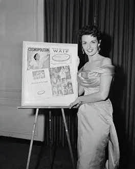 Jane Russell Standing Besides Magazine Poster