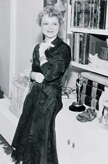 Janet Gaynor Posing with Her Oscar