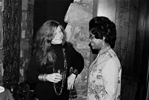 Prints of American blues and soul singer Janis Joplin talking to soul singer Carla Thomas (right) at the Stax Records Christmas party in Memphis, Tennessee, 20th December 1968 Classic Prints of Iconic Janis Joplin: Janis Joplin And Carla Thomas