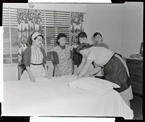 Japanese Brides Observing Nurse Diapering Baby