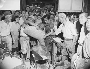 Flour Prints: Japanese Civilians Get Flour Rations