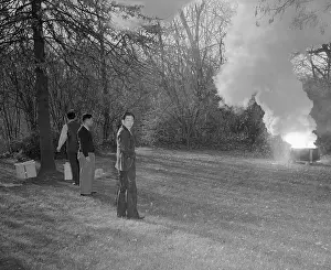 Japanese Embassy Workers Guarding Burning Documents on Lawn