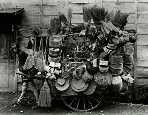 Selling Prints: Japanese Man Pulling Cart With Hats