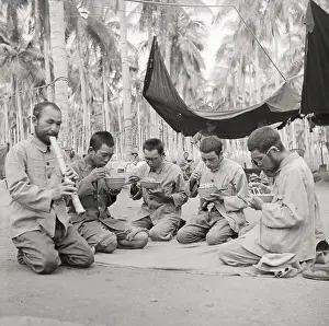 Guadalcanal Prints: Japanese Prisoners Eat Meal