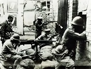 Shanghai Prints: Japanese Soldiers Waiting with Guns Behind Wall