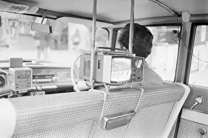 Portable Prints: Japanese Taxi Customers Watch Television