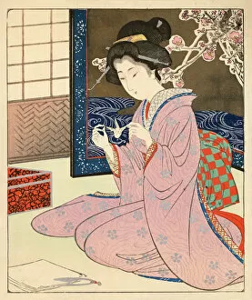 Traditional Japanese Woodblocks Gallery: Japanese Woodblock of a female making Origami