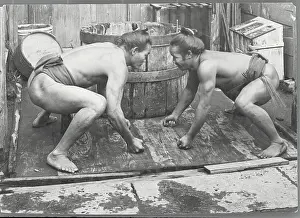 Prints of (Original Caption). Two Japanese wrestlers ready to begin their bout Grappling Through Time: A Visual Journey of Wrestling History: Japanese Wrestlers Beginning Bout