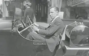 J.E. Murphy Driving His Car