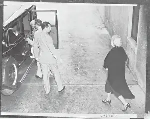Jean Bello Entering Car Assisted by Ex-Husband