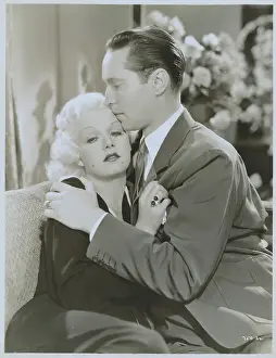 Jean Harlow and Franchot Tone Embracing