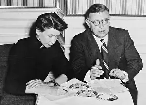 Jean-Paul Sartre Sitting at a Desk