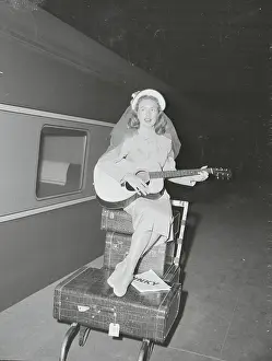 Jeanne Crain Playing the Guitar