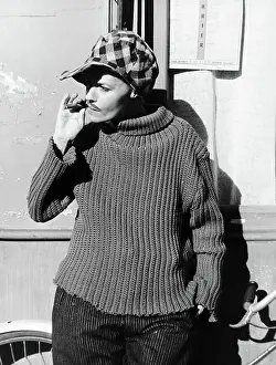 Cross Dresser Prints: Jeanne Moreau In Checkered Cap W/Cigar
