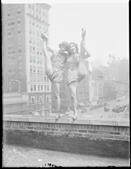 Balancing Prints: Jeannette Gilmore and Virginia Martin Holding Legs High