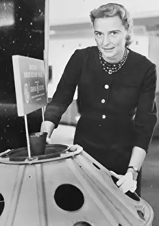 Jerrie Cobb Standing Near Satellite Model