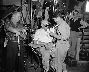 Jerry Lewis Taping Norman Taurog to His Chair