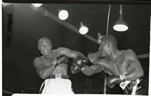 Jersey Joe Walcott Boxing Ezzard Charles for a Win