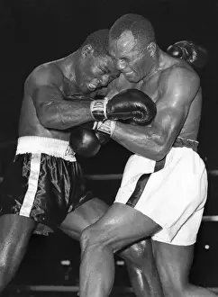 Jersey Joe Walcott Boxing Ezzard Charles for a Win