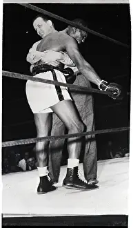 Injury Prints: Jersey Joe Walcott Being Carried By Ref