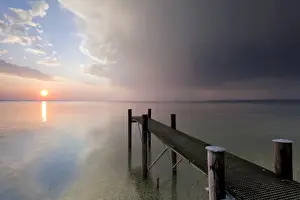 Lakeside Prints: Jetty with evening light and stormy atmosphere overlooking Lake Constance near Bregenz