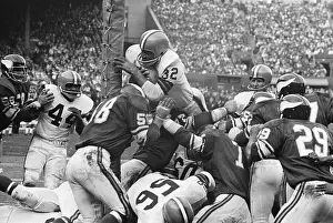 Jim Brown Leaping Over Opponents