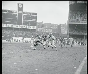 Jim Brown Playing to Win During Football Action