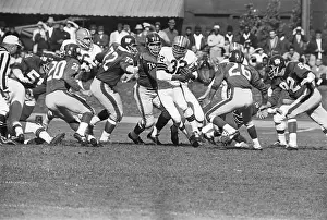 Chasing Prints: Jim Brown Pursued by Group of Players