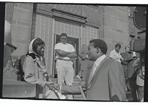 Jim Brown Shaking Hands with an unidentified Woman