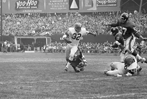 Jim Brown Being Tackled by Opponent