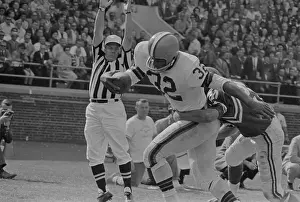 Jim Brown Being Tackled by Opponents