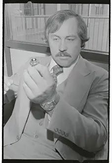 Jim Hunter Holding Baseball Ring