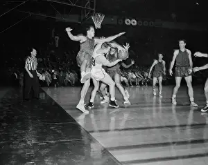 Jim Loscutoff Holding Onto a Basketball