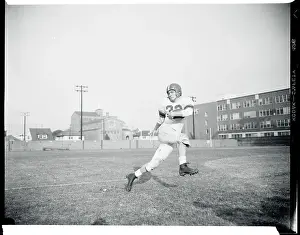 Jim Sears in Football Uniform and Running on Field