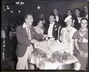 Birthday Prints: Jimmy Durante Cuts Cake at Party