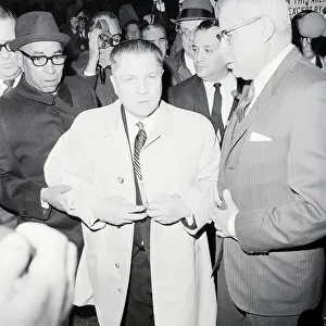 Jimmy Hoffa in Trench Coat Surrenders