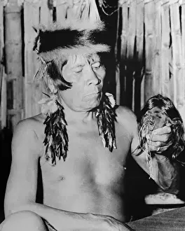 Peru Prints: Jivaro Warrior Displaying Shrunken Head