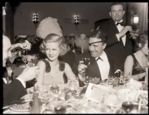 Joan Bennett and Raoul Walsh at Party