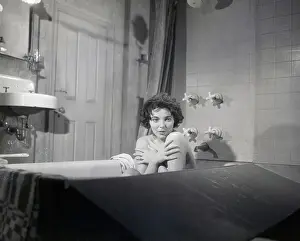 Taking A Bath Prints: Joan Collins Covering Chest in Bathtub