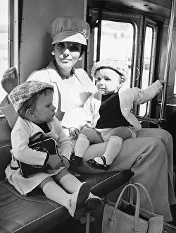 Joan Collins Sitting on Bus with her Children