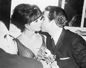 Joan Collins and Warren Beatty Kissing