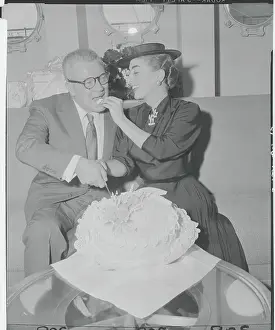 Joan Crawford Feeding Cake to Husband