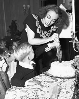 Joan Crawford Helping Son Cut Birthday Cake