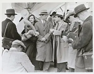 Prints of Joan Crawford and Robert Montgomery star in the film, Untamed, a Metro-Goldwyn-Mayer A Glamorous Life Captured: Joan Crawford Holding Onto Robert Montgomery Arm
