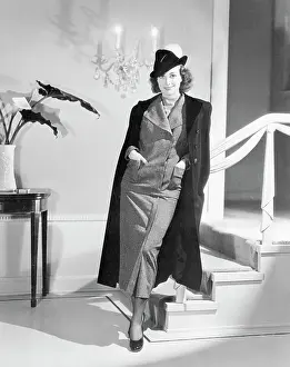 Prints of (Original Caption). When Off to the Races. Joan Crawford, MGM star, dons this smart two-piece suit mannishly tailored in small black and white checked fabric A Glamorous Life Captured: Joan Crawford Posing in Two Piece Tailored Suit