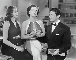 Joan Crawford with Rita Hayworth and John Carroll